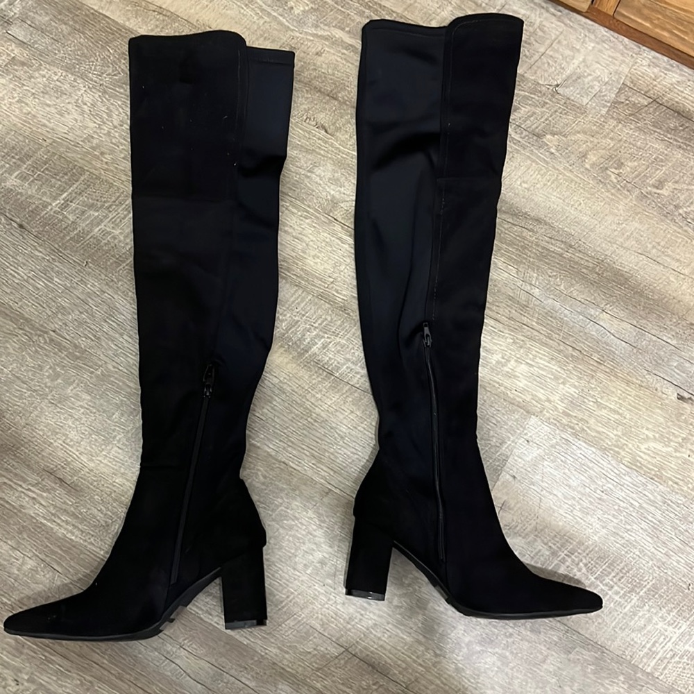 Thigh high black tall boots